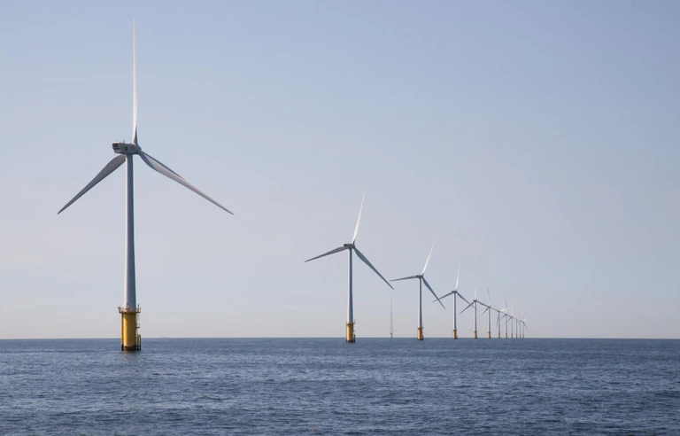 Offshore Development Center Australia concept with offshore wind turbines in ocean representing sustainable infrastructure
